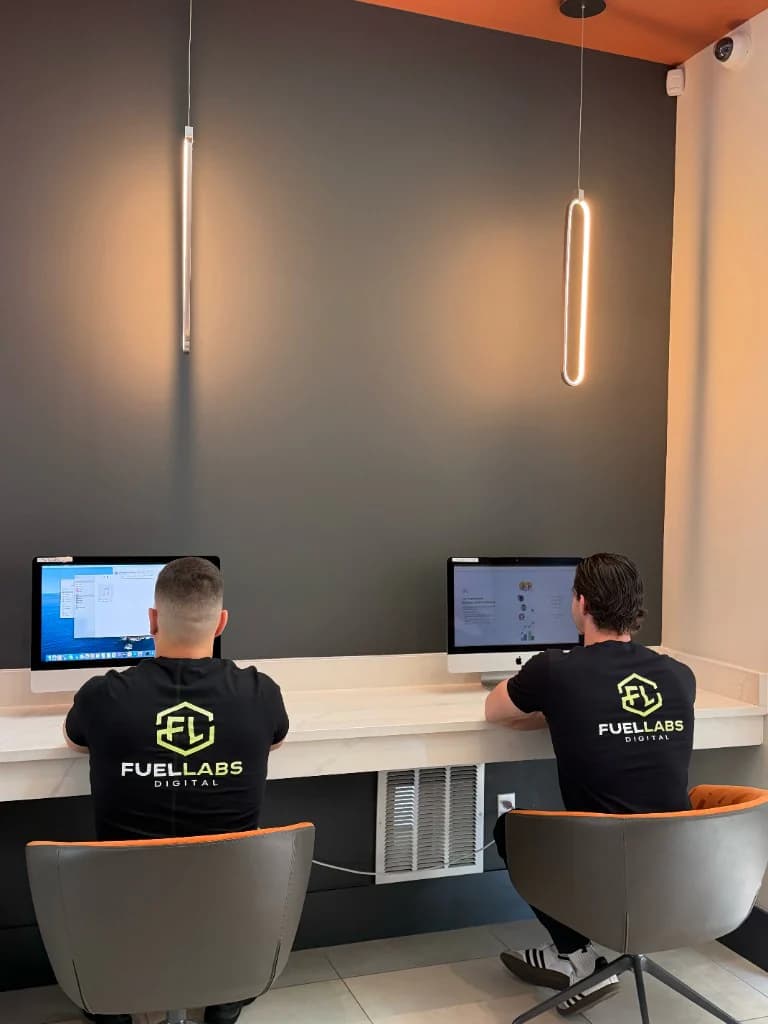 FuelLabs founders standing together in the office lobby
