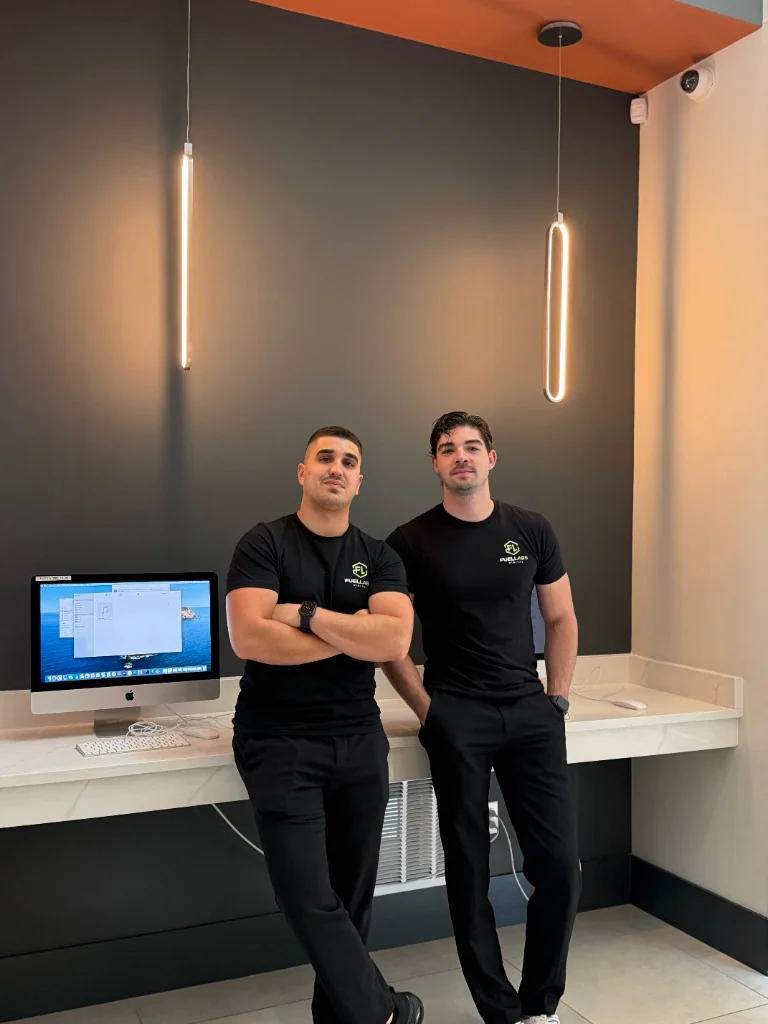 FuelLabs founders standing in the office with confident poses