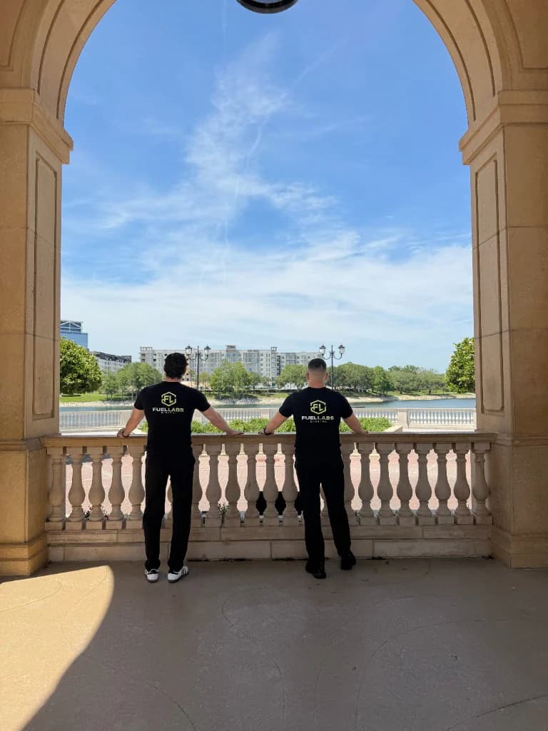FuelLabs founders standing under an archway outdoors