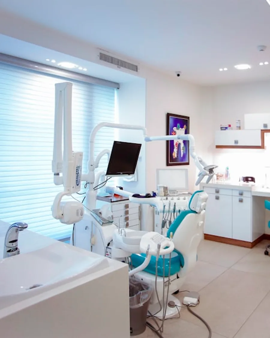 Dental clinic ad creative with headline, reassurance line, and booking CTA on a clinical setting photo.