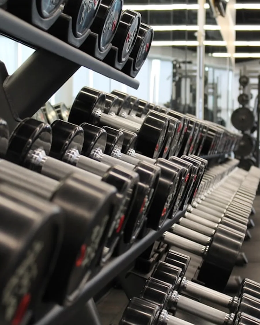 Gym membership ad with training floor visual, headline, trial offer, and CTA.