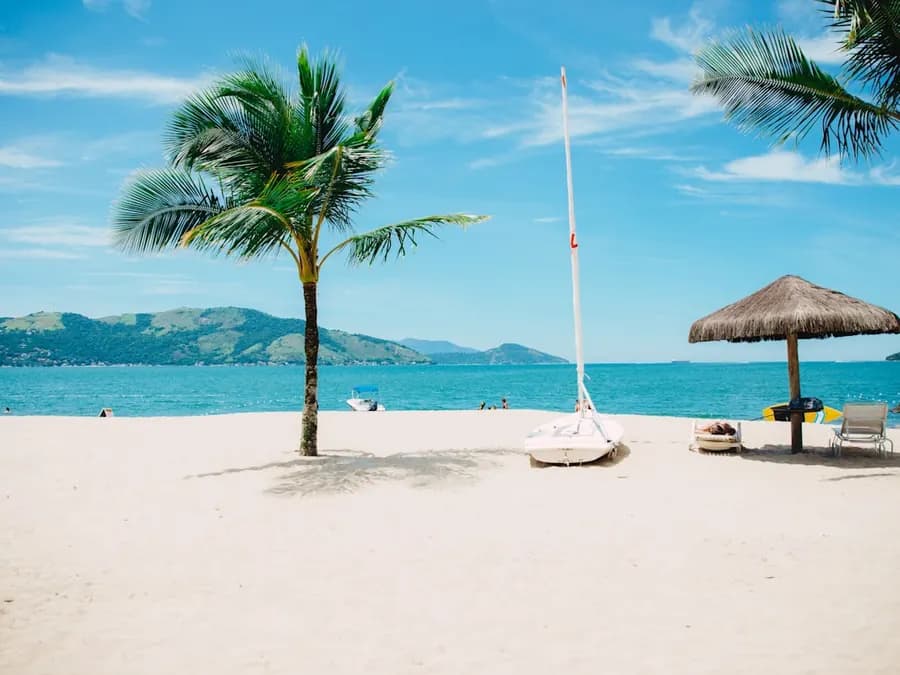 Coastal shoreline with turquoise water and soft sand
