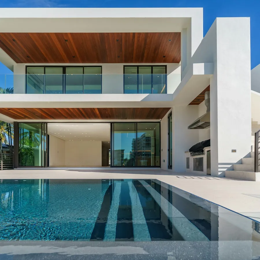 Detail of a modern white Florida residence with wood soffits