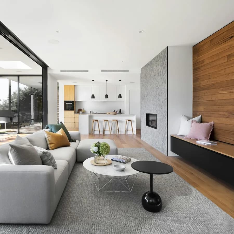 Luxury living room with fireplace wall and wood paneling